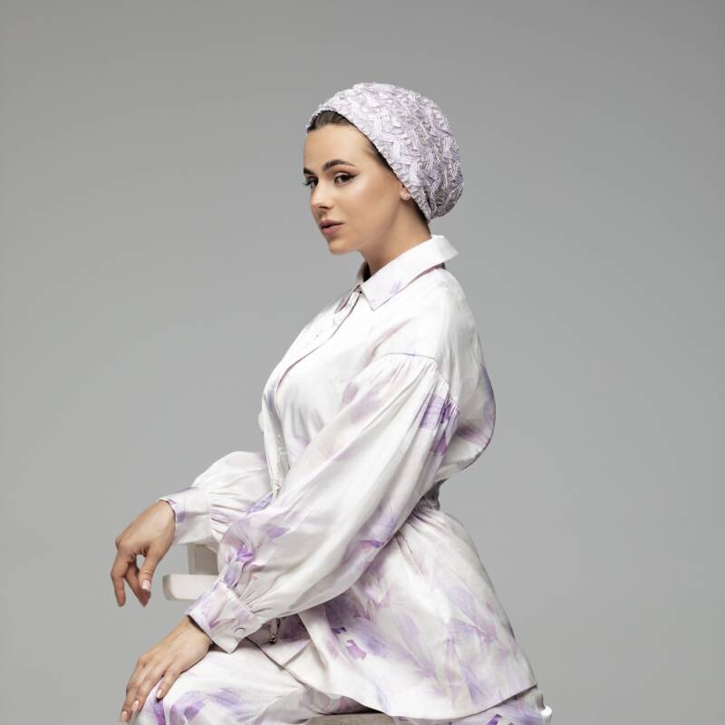 Purple lace turban with delicate lace details, offering a stylish and feminine touch.